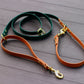 Biothane Multifunctional Dog Leash in Vibrant Orange and Green with Golden Carabiners, elegantly displayed on a wooden surface.